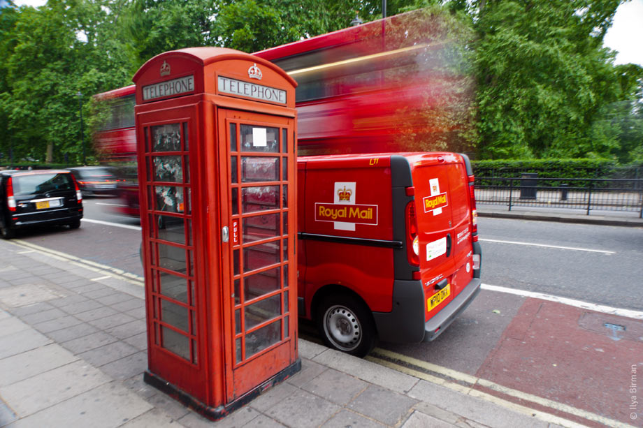 A phone booth, a Rolay Mail van and a bus in London