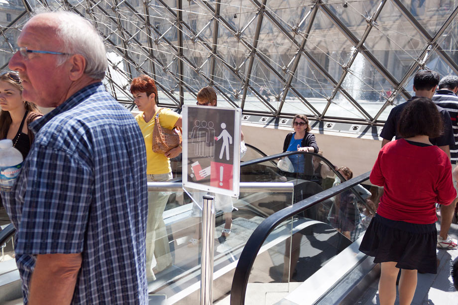 A strange sign is installed in Louvre