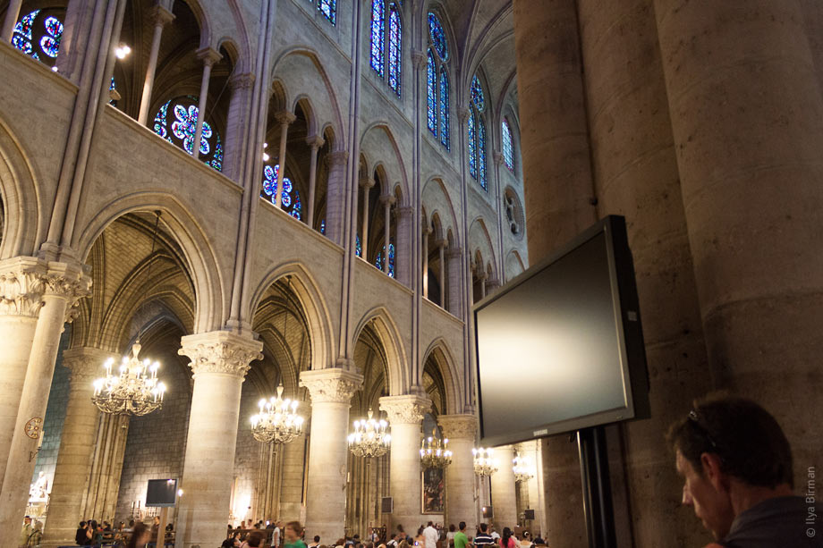 Plasma display panels are mounted to the walls of Notre Dame de Paris