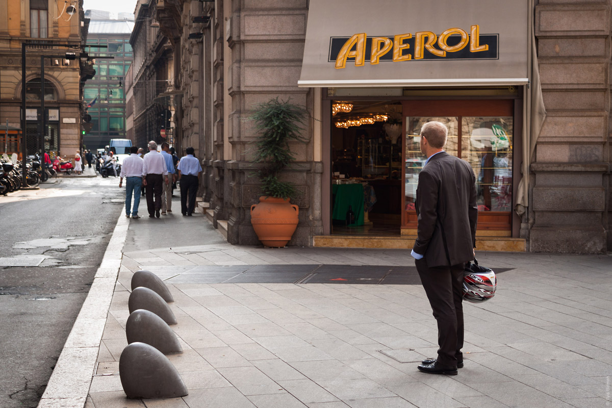 Suits ride motorcycles in Milan