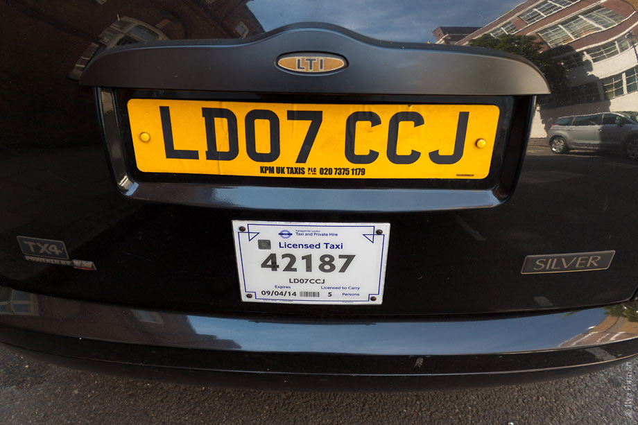 Taxi license plate uses New Johnston typeface, standard for the public transport in London