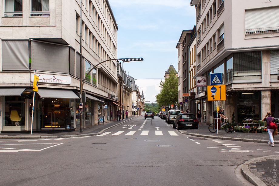 A street light above a pedestrian crossing in Luxembourg