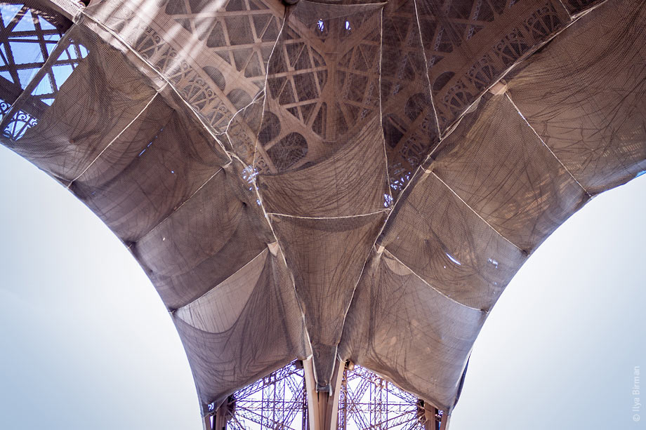 The Eiffel Tower is covered with shabby rags