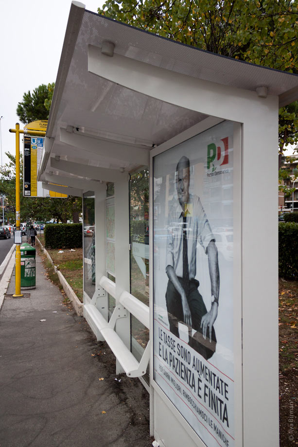 A bus stop with an integrated bench